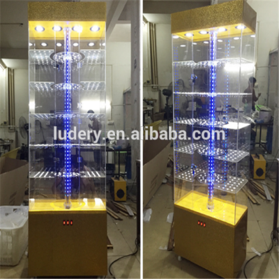 Luxury store floor standing Rotating Hexagonal glass display showcase/Tower showcase display/acrylic showcase design